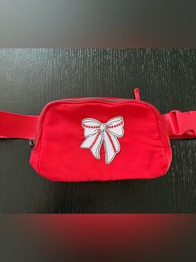 Red belt bag with baseball bow